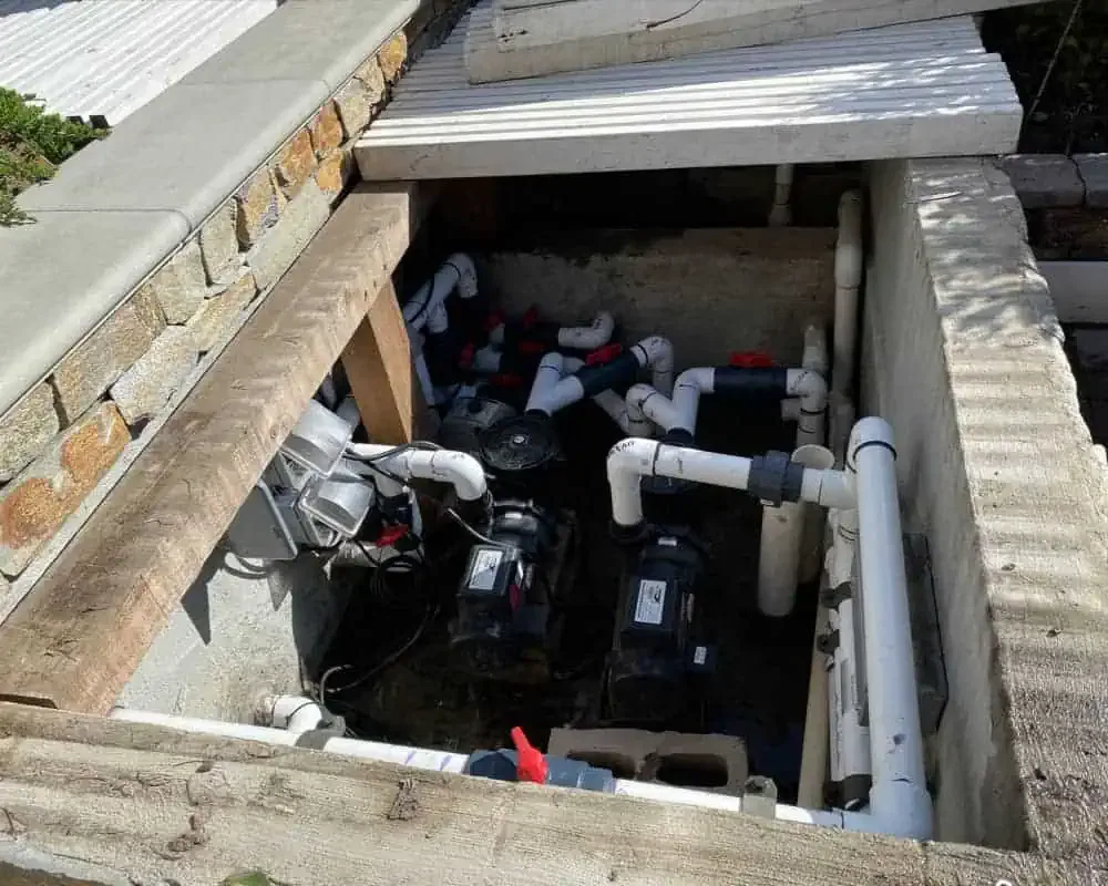 A koi pond pump is installed in a concrete cellar
