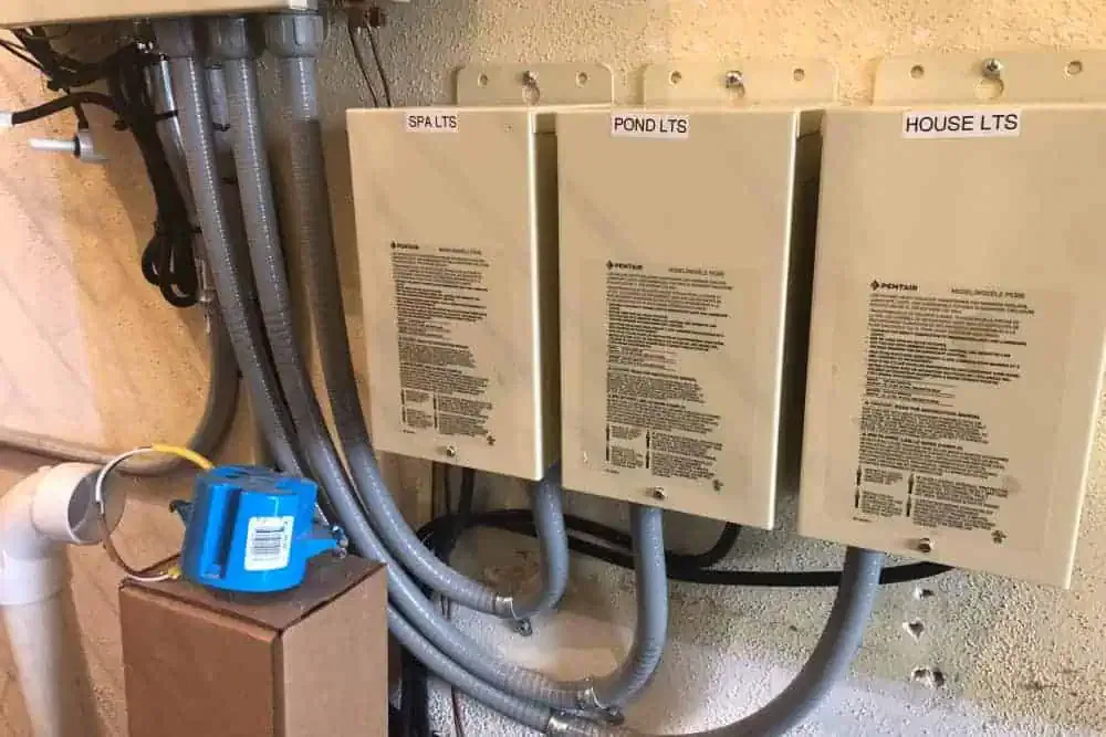 Three labeled electrical control boxes for 