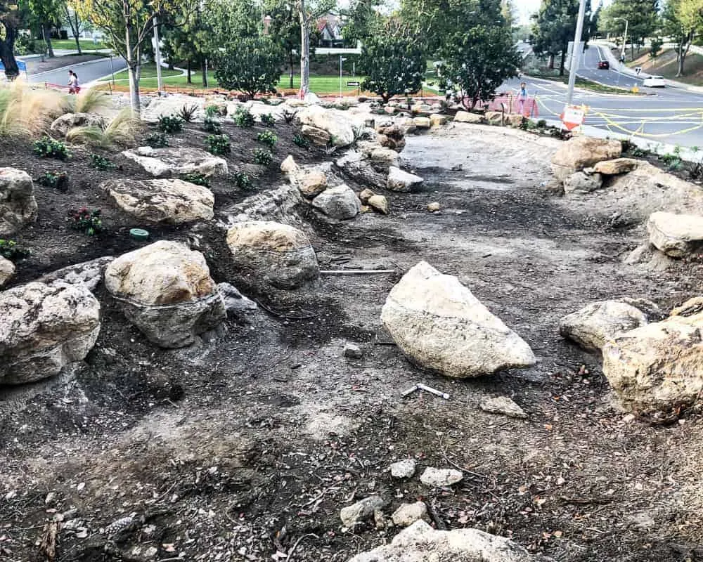 A rock garden in the middle of a street.