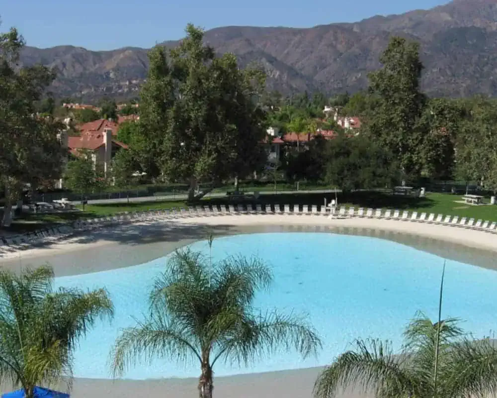 A swimming pool with a mountain in the background.